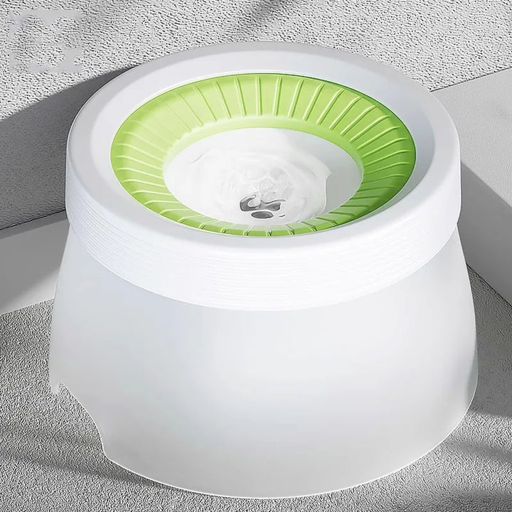 Green pet waterer designed to prevent spills, a great travel accessory for mess-free dog feeding.
