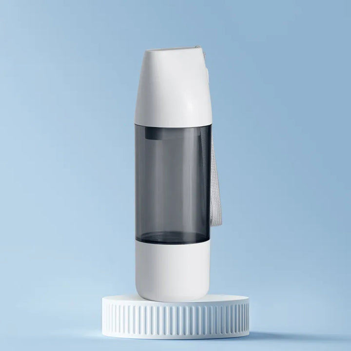 Durable white pet travel water bottle with built-in leak-proof dispenser for dog hydration needs