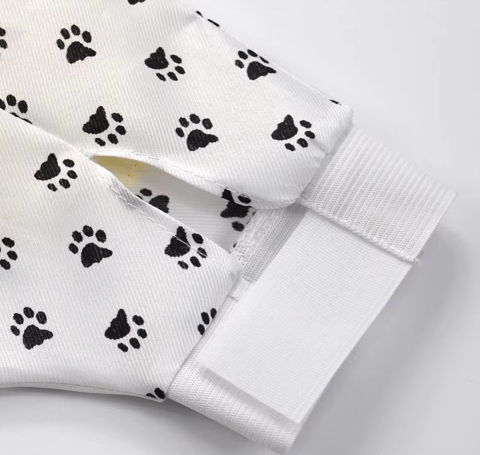 White pet grooming glove with adjustable strap, suitable for massage and de-shedding pets