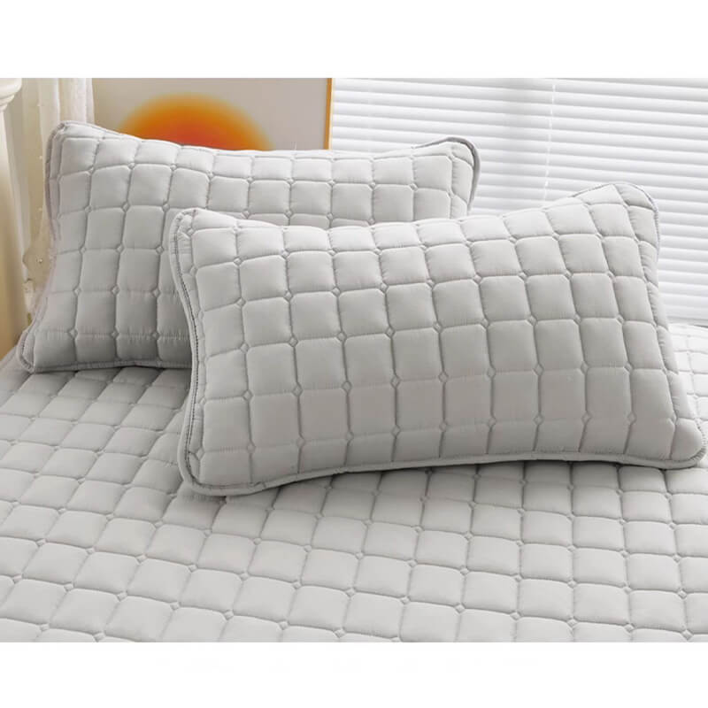 Waterproof mattress protector in an unrolled state across a mattress, ready for sheeting.