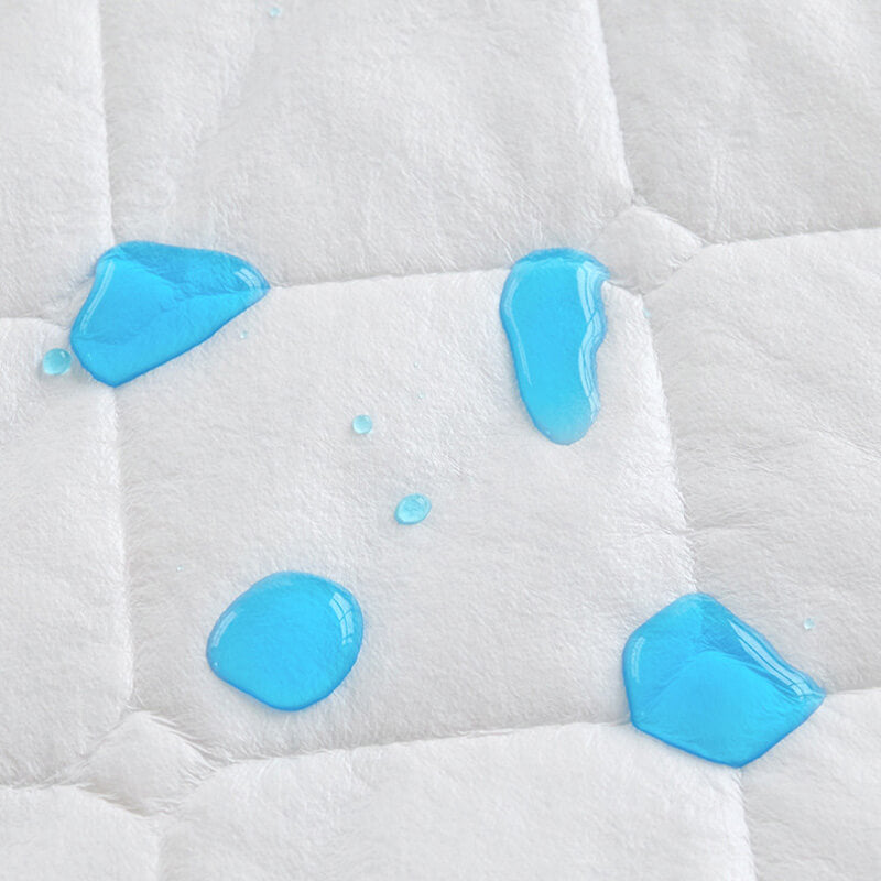 Corner detail of a waterproof mattress protector, showing durable, reinforced stitching.