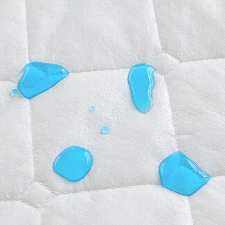 Corner detail of a waterproof mattress protector, showing durable, reinforced stitching.