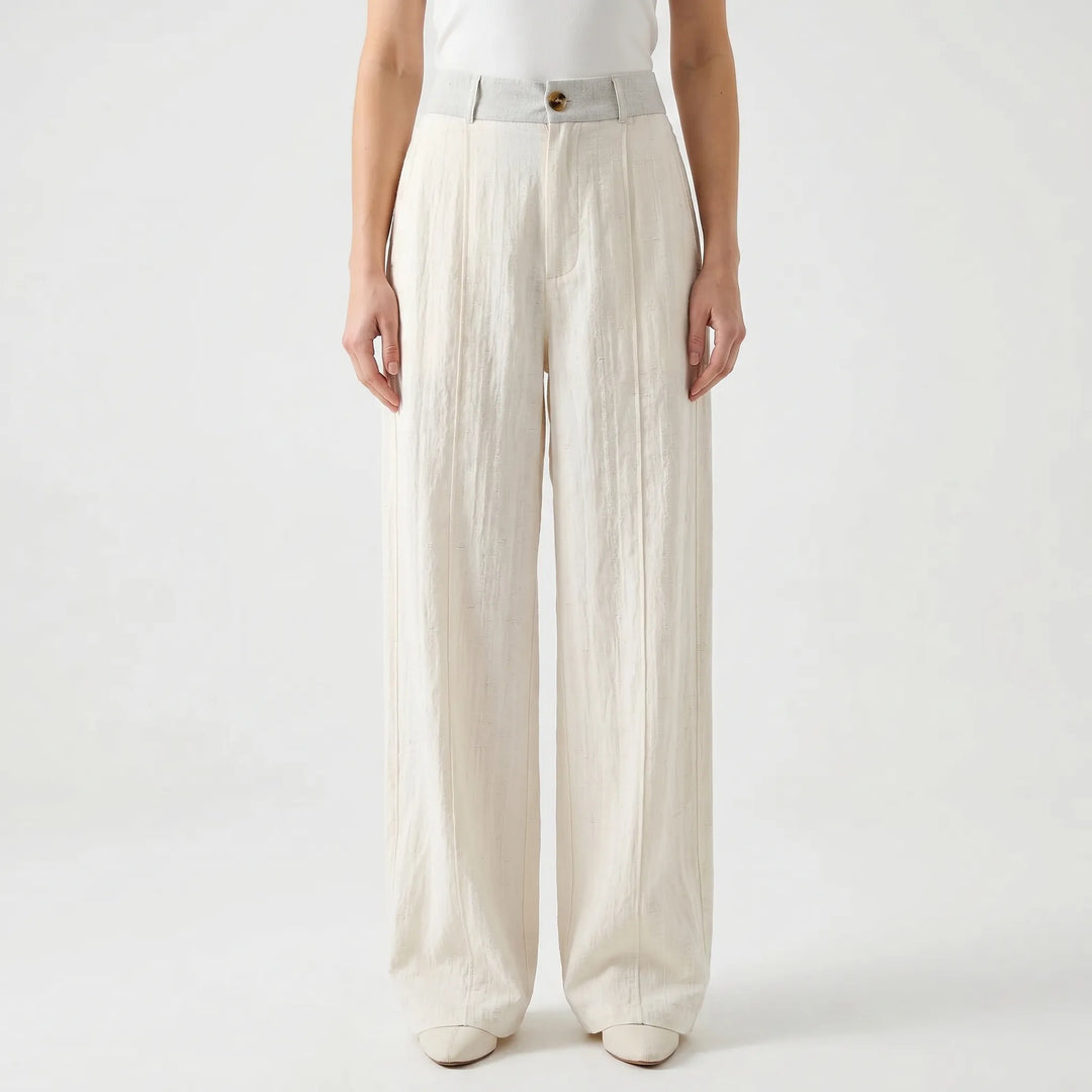 Beige wide-leg women's summer trousers, comfortable & flowy mid-rise fit. Ideal for spring fashion & relaxed wear.