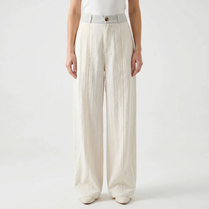 Beige wide-leg women's summer trousers, comfortable & flowy mid-rise fit. Ideal for spring fashion & relaxed wear.