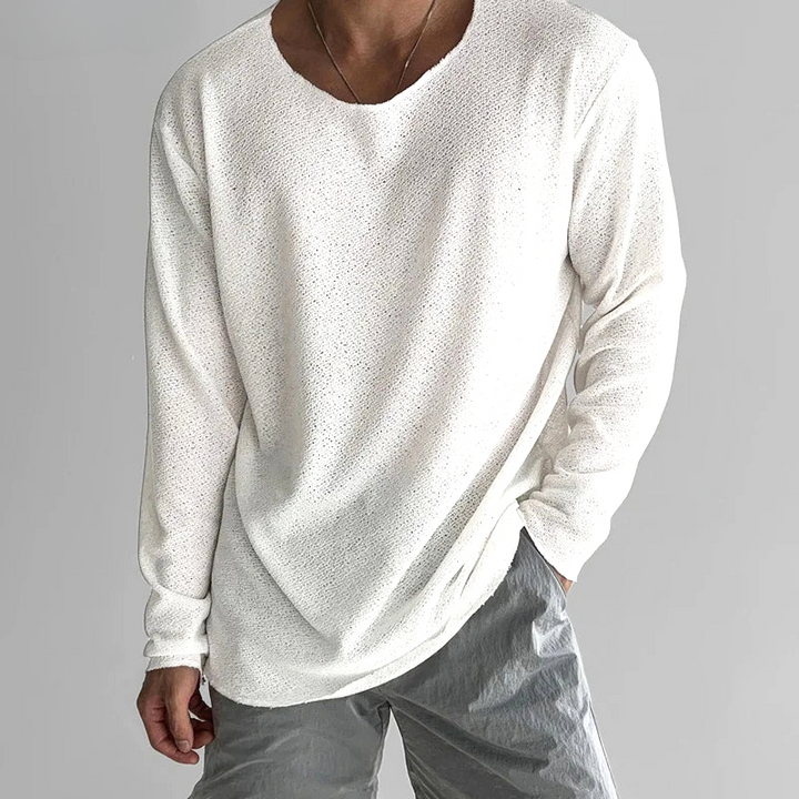 Unisex long-sleeve tee for effortless everyday comfort, featuring a relaxed fit and breathable fabric. Casual minimalist top.