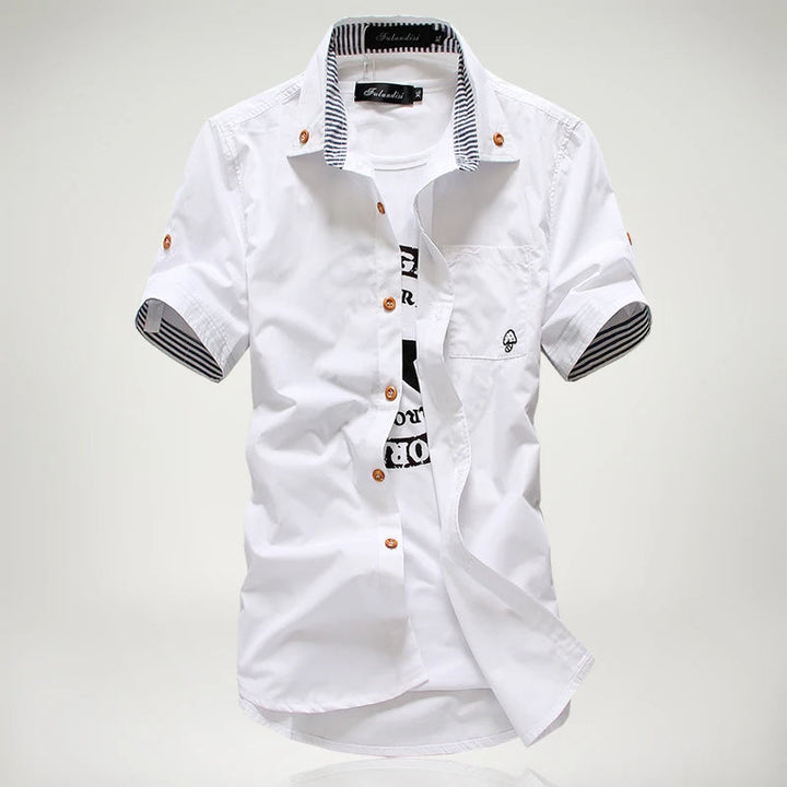 Relaxed men's short sleeve button-up cotton shirt, fashionable contrast stitching for casual look.