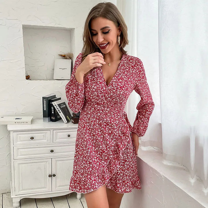 Stylish long-sleeve V-neck mini wrap dress for women, featuring ruffles, in a rich autumn wine red.