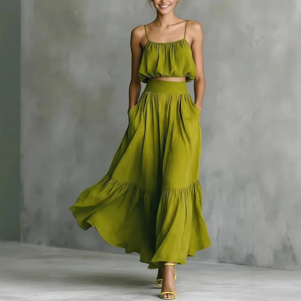 Woman in elegant ruffle hem crop top & flowy maxi skirt set, perfect for beach vacation or summer resort wear.