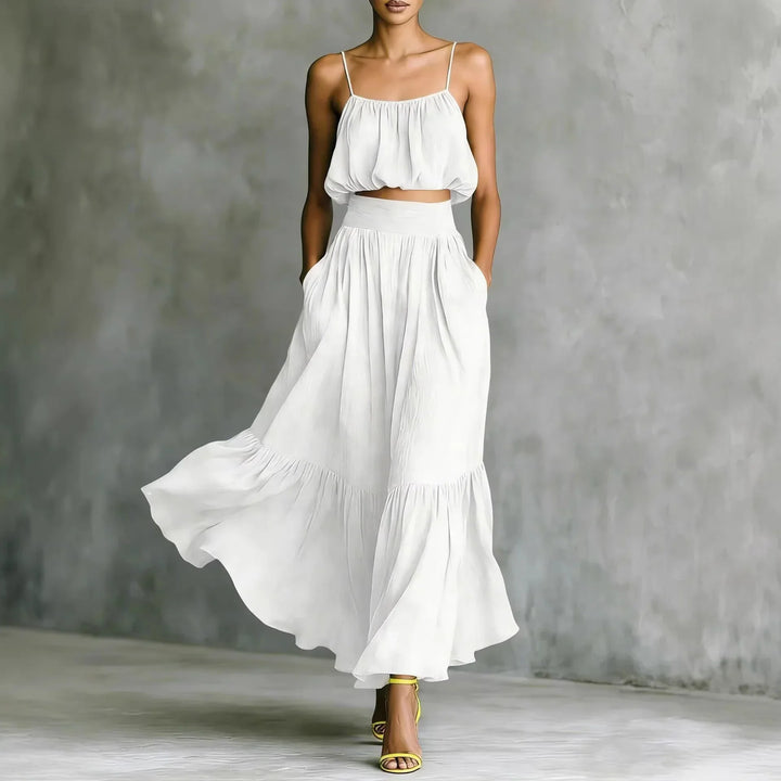 Stylish women's ruffle hem crop top & maxi skirt two-piece set for comfortable summer beachwear and resort look.
