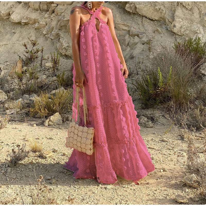 Close-up of the fabric on a women's flowy summer maxi dress, showing its lightweight & comfortable texture.