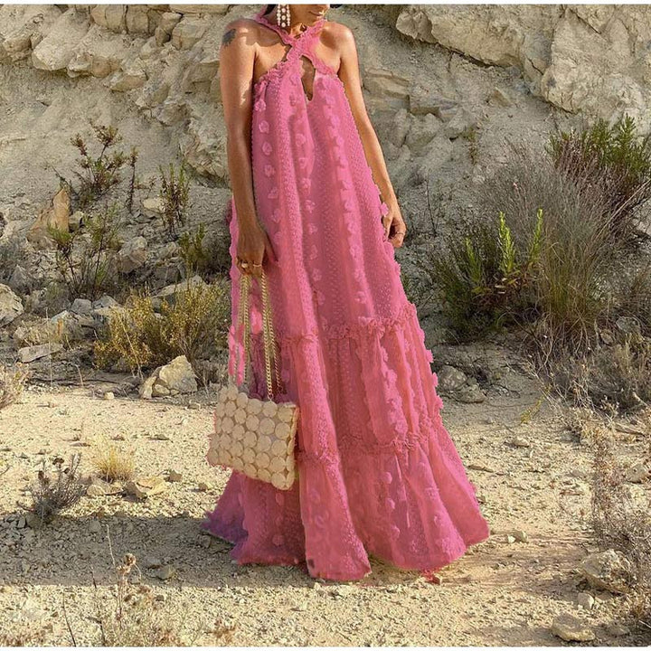 Close-up of the fabric on a women's flowy summer maxi dress, showing its lightweight & comfortable texture.