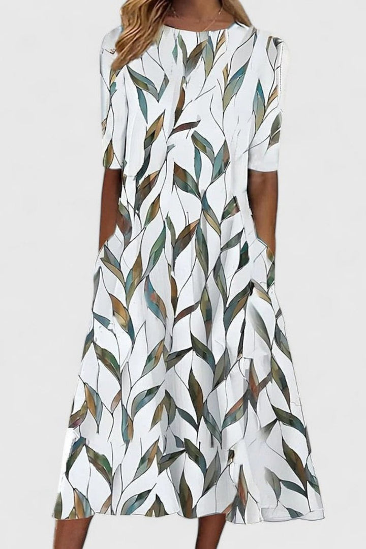 Floral print women's A-line midi dress with short sleeves and pockets, a versatile everyday summer dress.