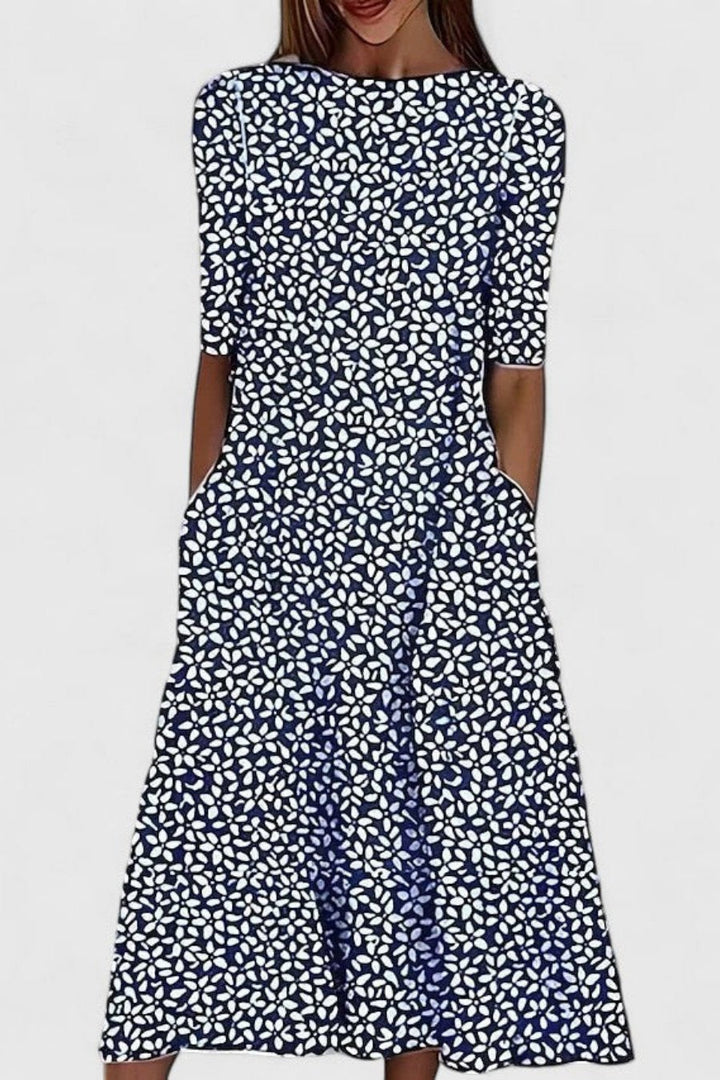 Comfortable women's A-line midi dress featuring short sleeves, pockets, and a flattering silhouette for everyday style.