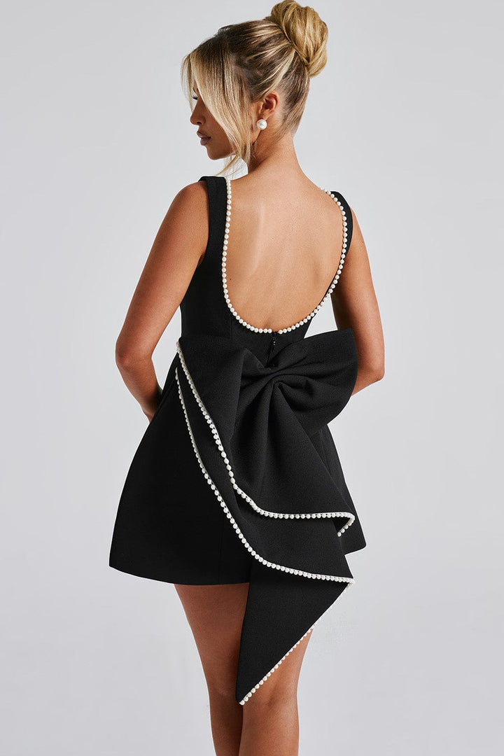 A-line mini dress for women with elegant pearl trim and a show-stopping statement back bow, ideal for parties.