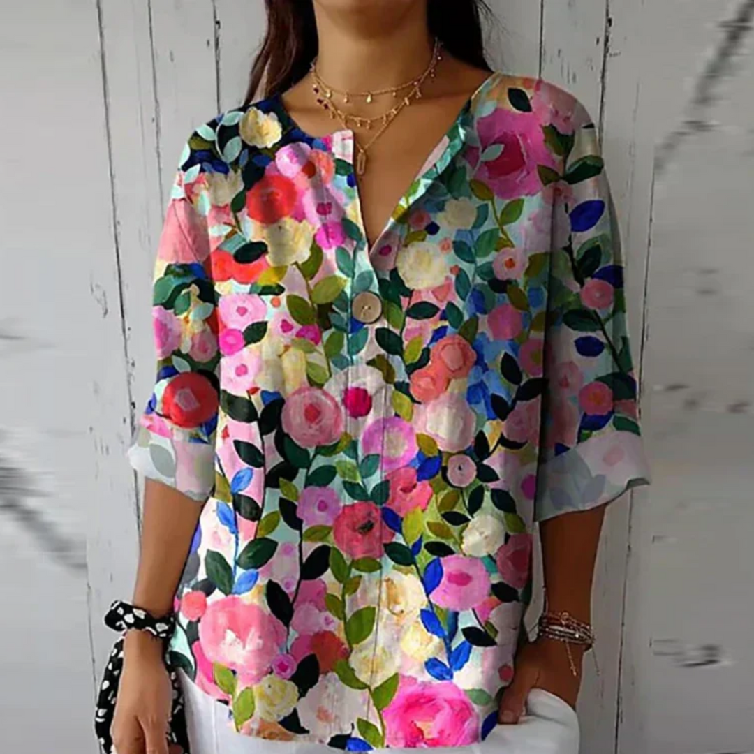 Comfortable women's V-neck blouse with abstract floral print. Relaxed fit, 3/4 sleeve summer top for everyday wear.