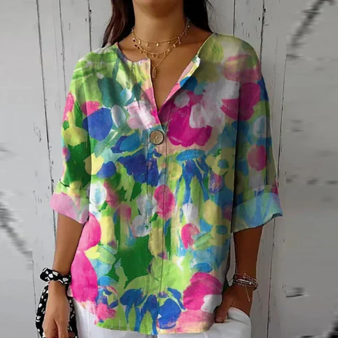 Women's abstract floral V-neck blouse. Relaxed fit, 3/4 sleeve. Perfect summer top for warm weather women's fashion.