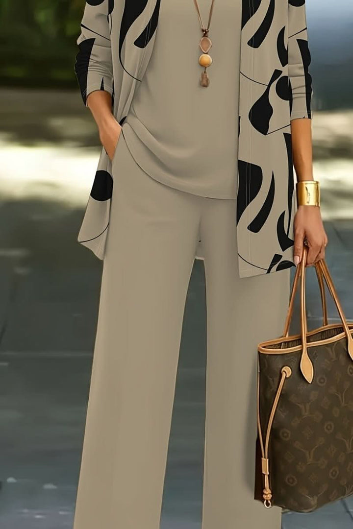 Women's abstract print 3-piece coordinated set. Stylish loungewear with a modern, colorful pattern.