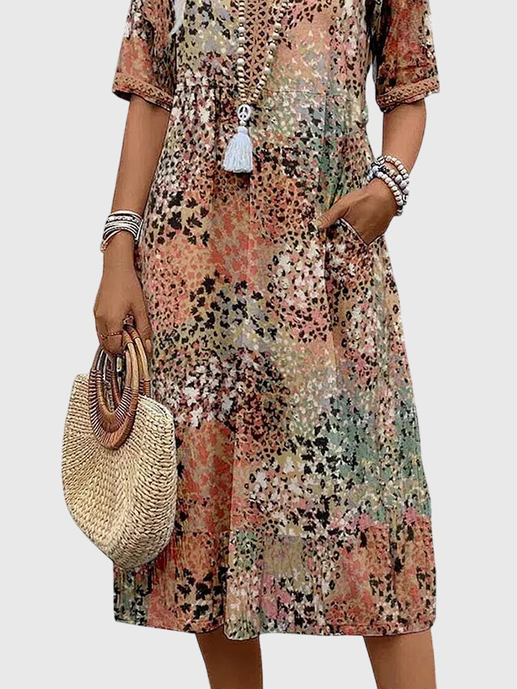 Stylish women's summer vacation dress, V-neck abstract print boho midi with flutter sleeves for a chic look.