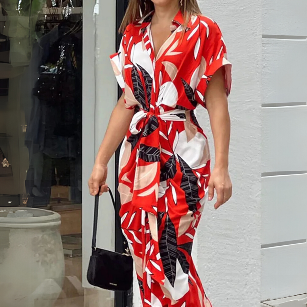 Fashion-forward women's collared abstract print midi dress with button front and flattering tie-waist detail.