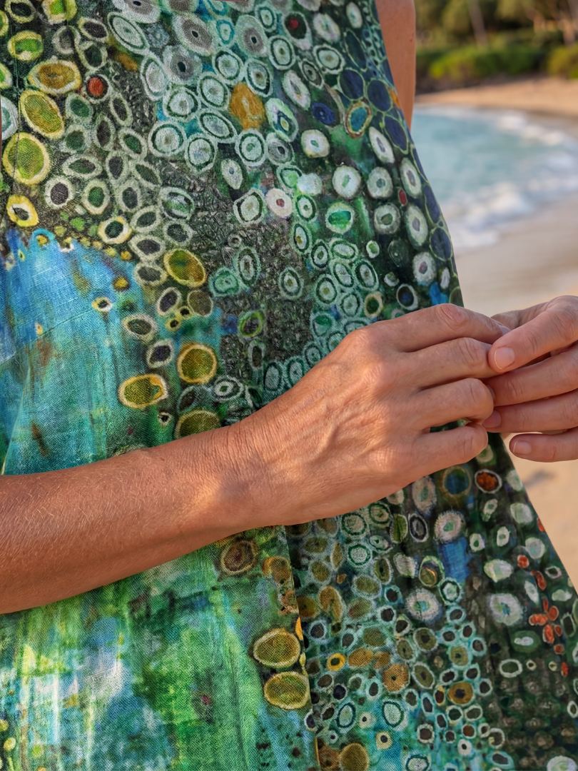 Elegant women's abstract print sleeveless midi dress, perfect for summer beaches & vacations, featuring a round neck.