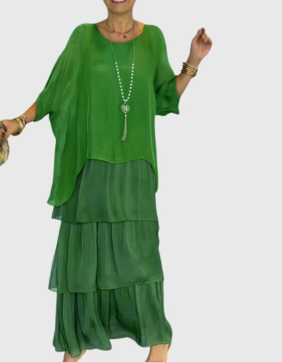 Festival fashion women's abstract print maxi dress, tiered flowy bohemian statement piece.