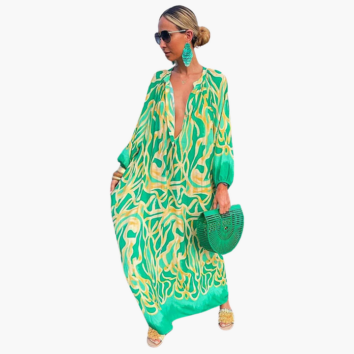 Women's abstract print V-neck oversized maxi dress, perfect for beach or resort wear. Flowy summer fashion.