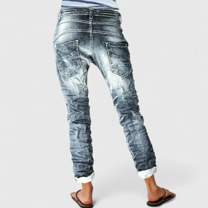 Women's acid wash skinny jeans with distinctive button fly and stylish contrast stitching, ideal for fashion.