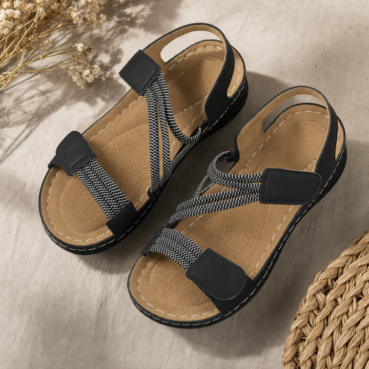 Women's comfort sandals featuring adjustable elastic straps & hook-and-loop closure for a custom fit.