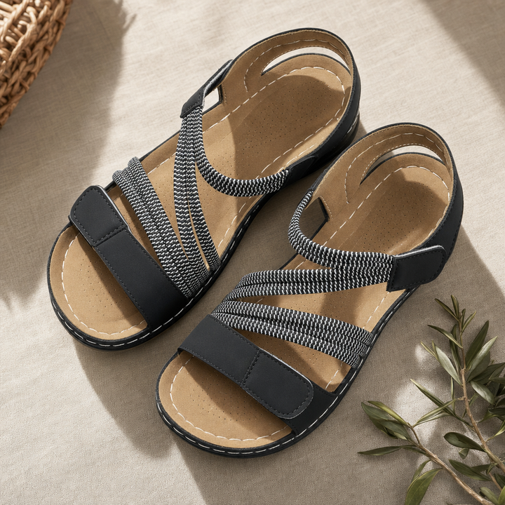 Women's adjustable comfort sandals providing secure fit & cushioned support with elastic straps for walking.