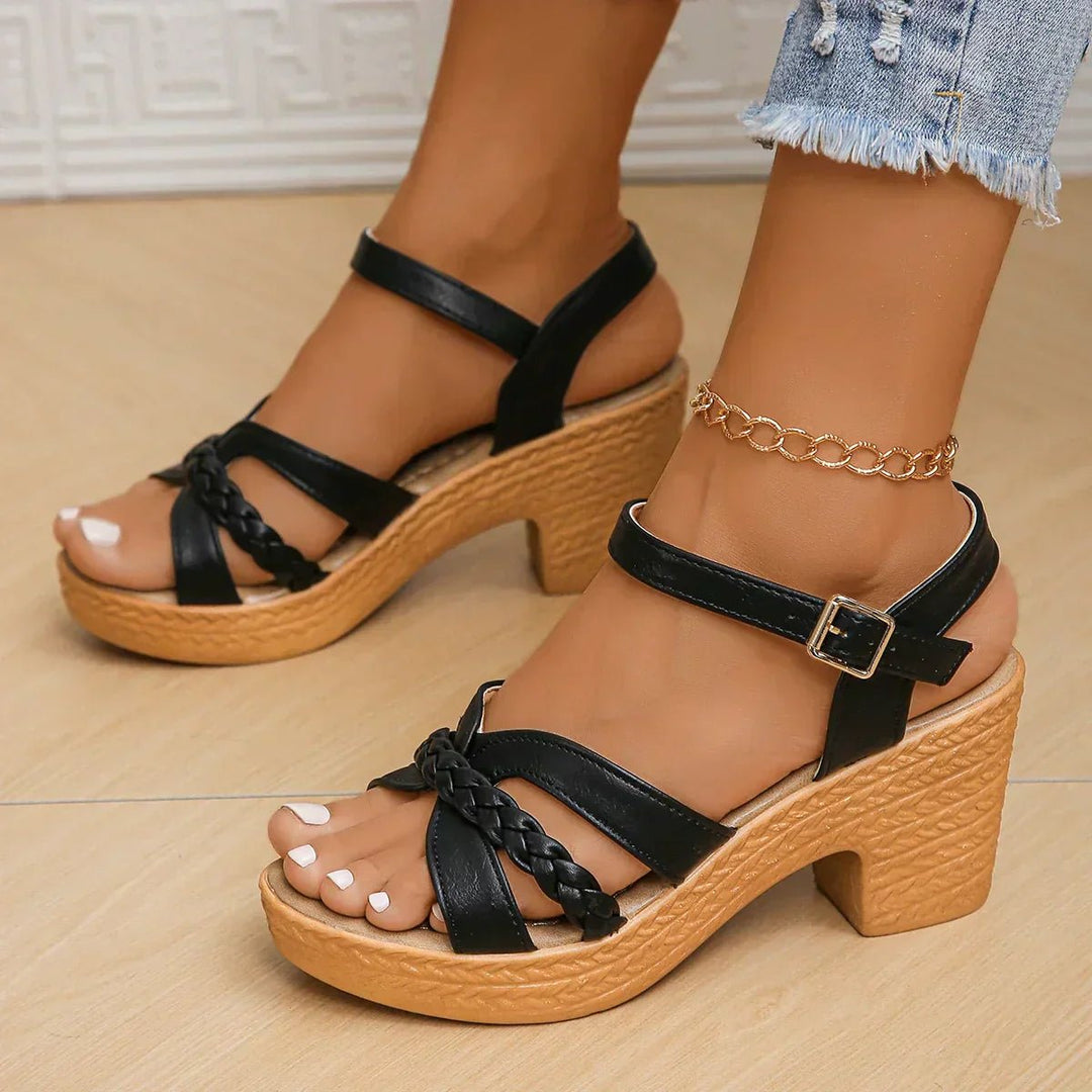 Women's espadrille sandals with woven platform sole & adjustable cross-straps for stylish summer comfort.