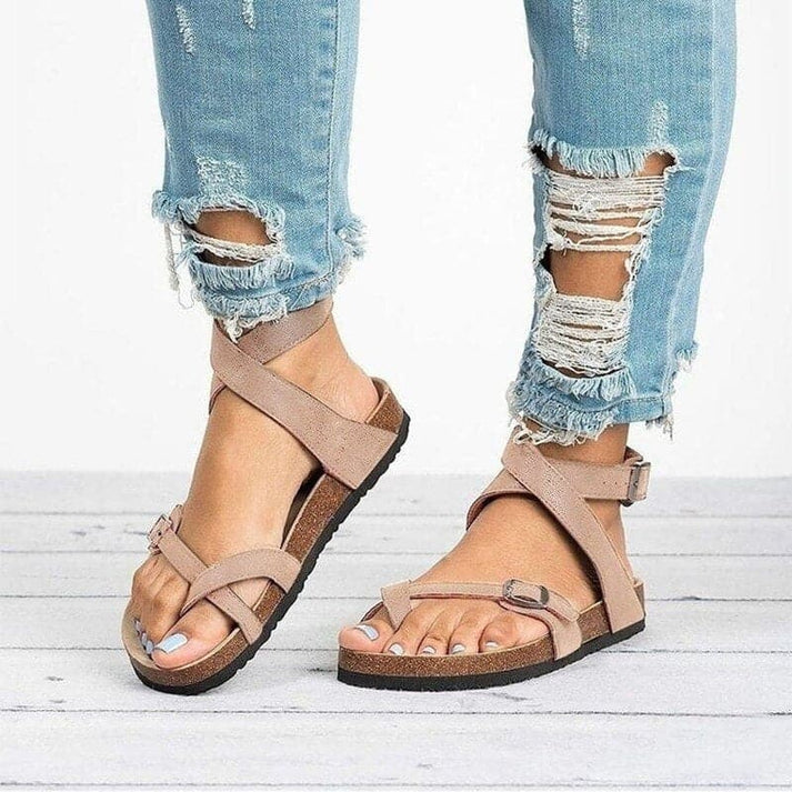 Stylish women's black adjustable strappy flat sandals, offering versatile comfort for any casual outfit.