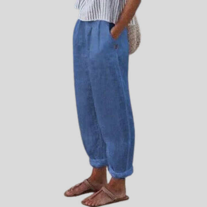 Flowy women's comfort trousers with folded hem, ideal for warm weather and everyday elegant casual style.