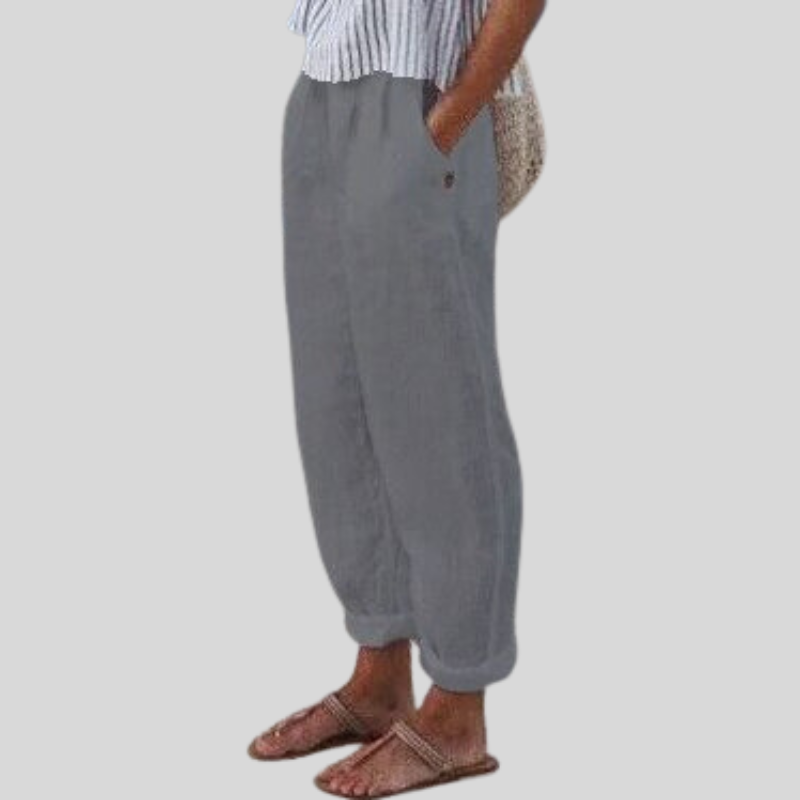 Comfortable women's pants with relaxed fit & folded hem, embodying effortless style for warm weather.