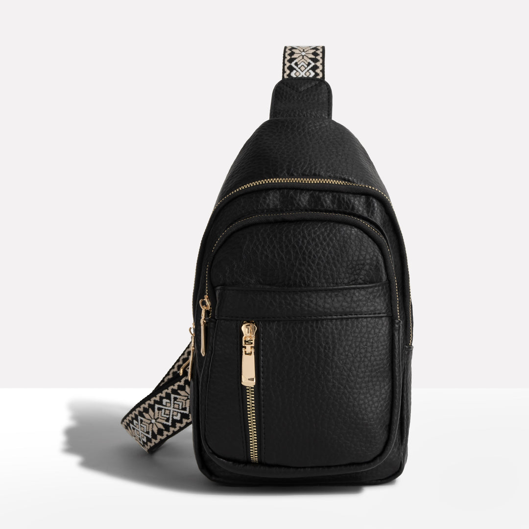 Women's anti-theft sling backpack with a decorative strap, perfect for travel & security. RFID protected crossbody bag.