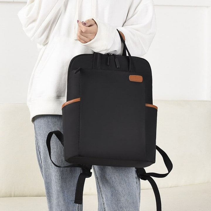 Women's water resistant anti-theft backpack, ideal for commuters and students.