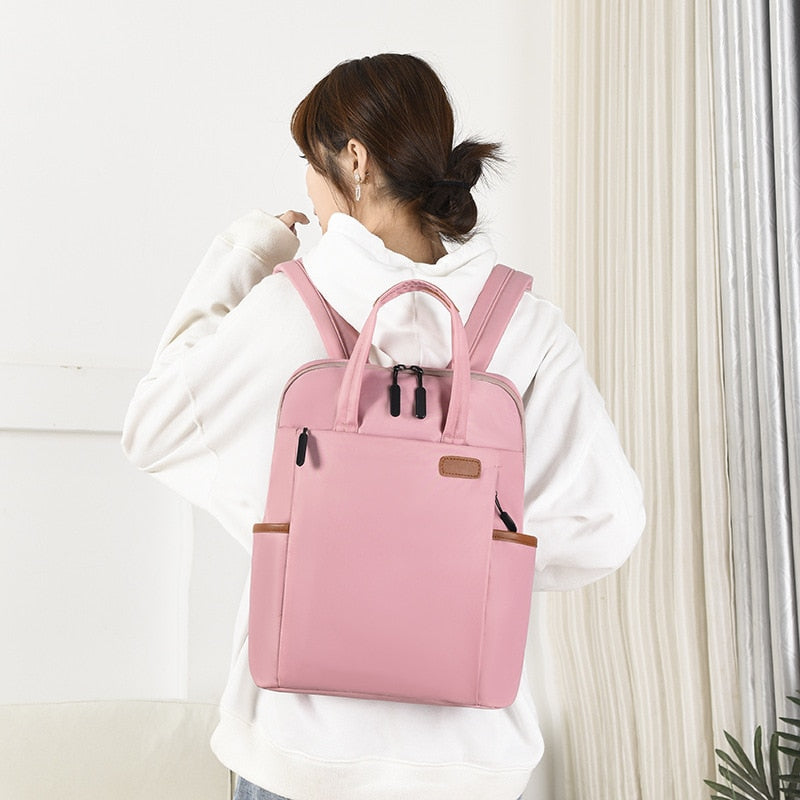 Durable women's school backpack, lightweight & anti-theft with water resistant oxford fabric.