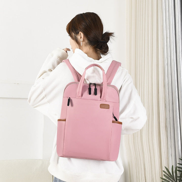 Durable women's school backpack, lightweight & anti-theft with water resistant oxford fabric.