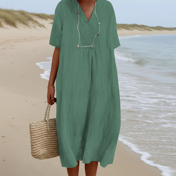 Flowy women's Aria summer dress, A-line midi cut with V-neck. Ideal casual beachwear for ultimate comfort.
