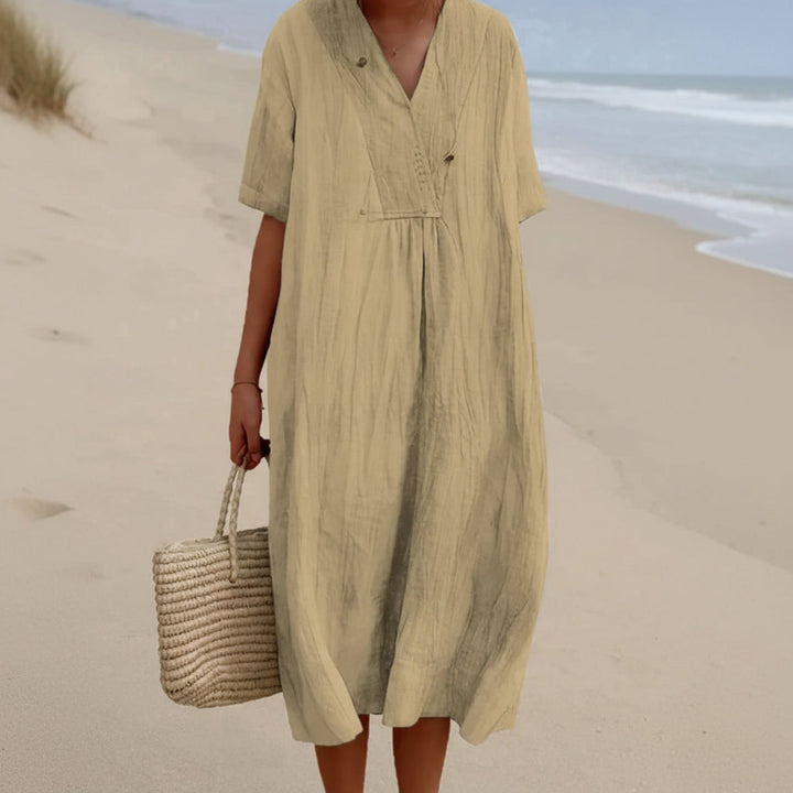Ultimate comfort women's Aria summer dress. Chic A-line V-neck midi style with pockets for fashion & leisure.