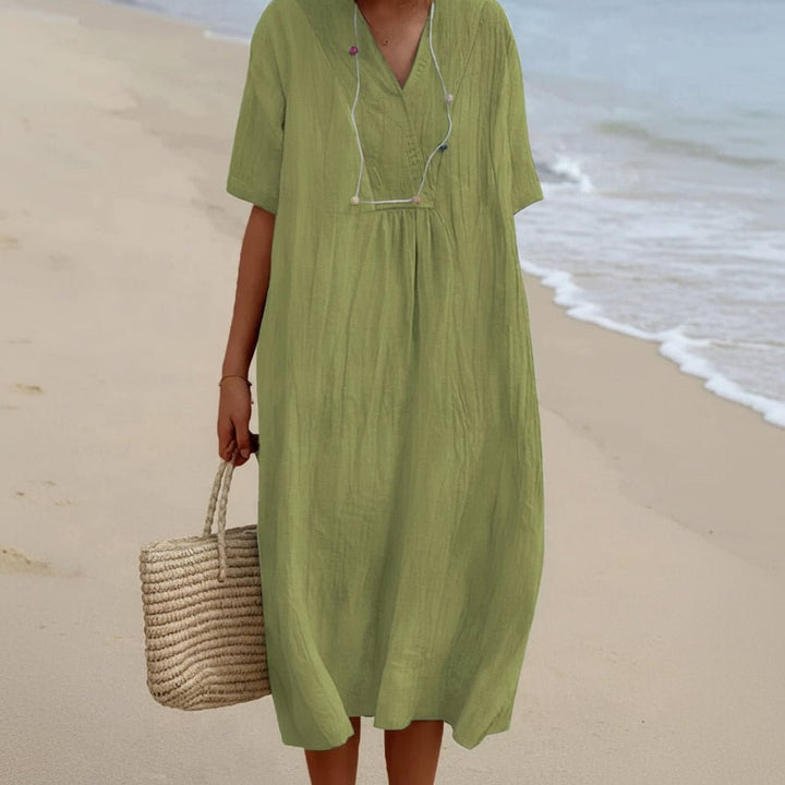 Versatile women's Aria summer dress. Comfortable A-line midi with pockets, ideal for casual, beach or vacation.