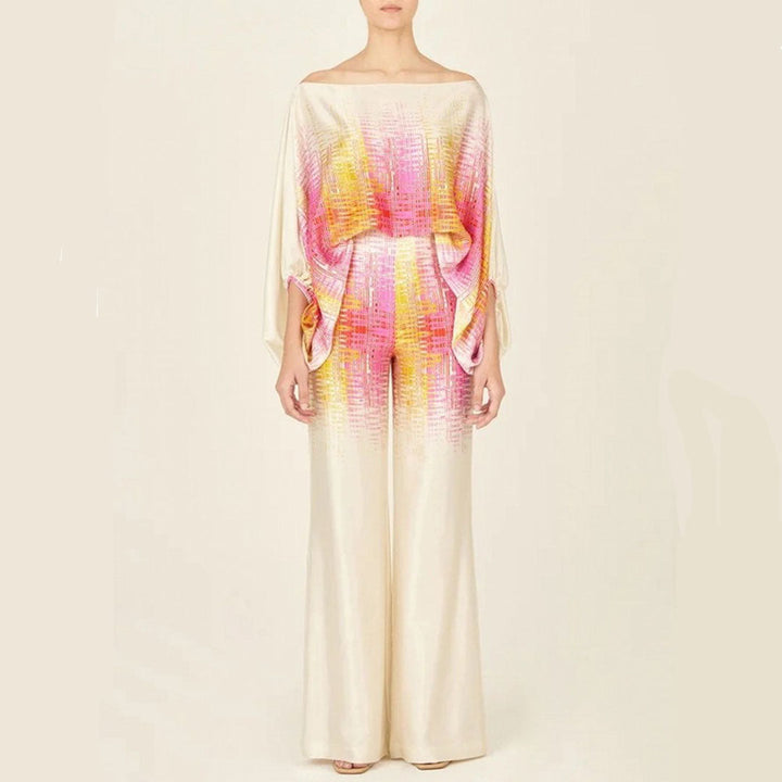 Vibrant artistic abstract print women's one-shoulder wide-leg pants set, a chic and eye-catching vacation outfit.