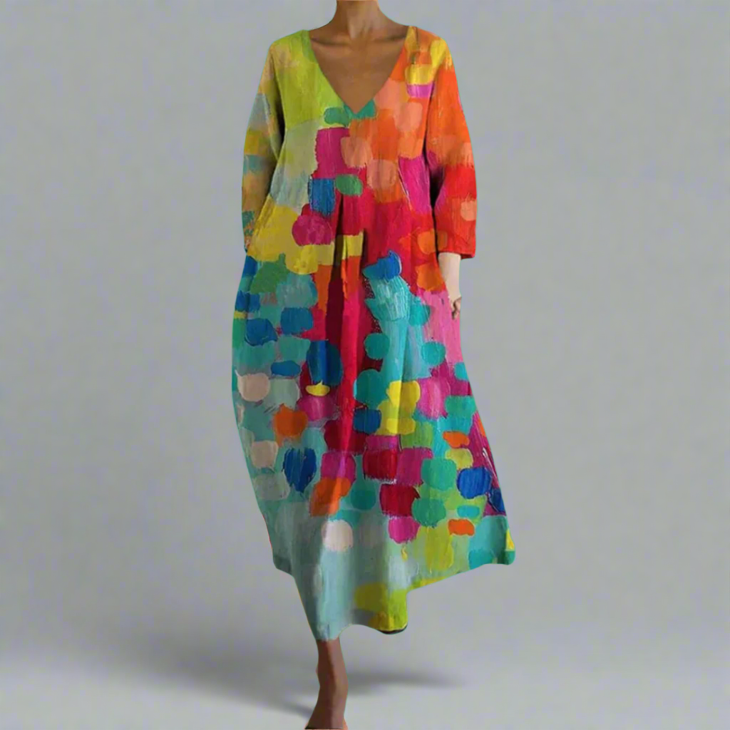 Women's artistic bohemian colorful maxi dress with flowy fabric, abstract print, perfect for summer vacation or beach.