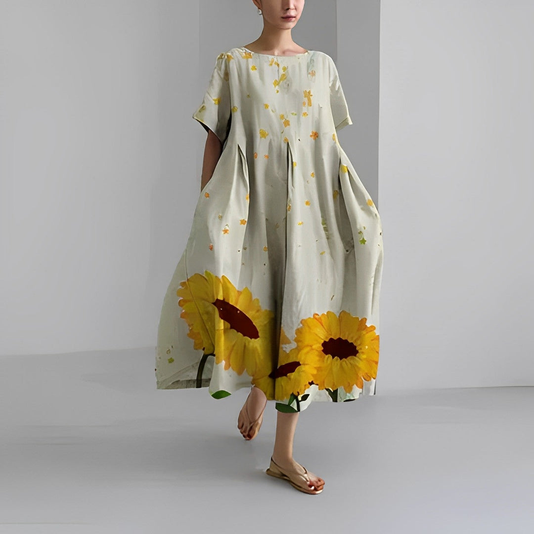 Women's short sleeve relaxed midi dress with artistic print & convenient pockets. Great for everyday comfort.