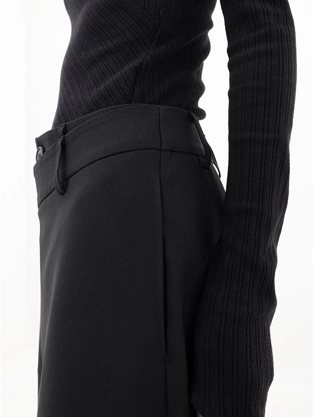 Flowy wide leg women's baggy trousers, featuring an asymmetric detail & relaxed fit for chic comfort.