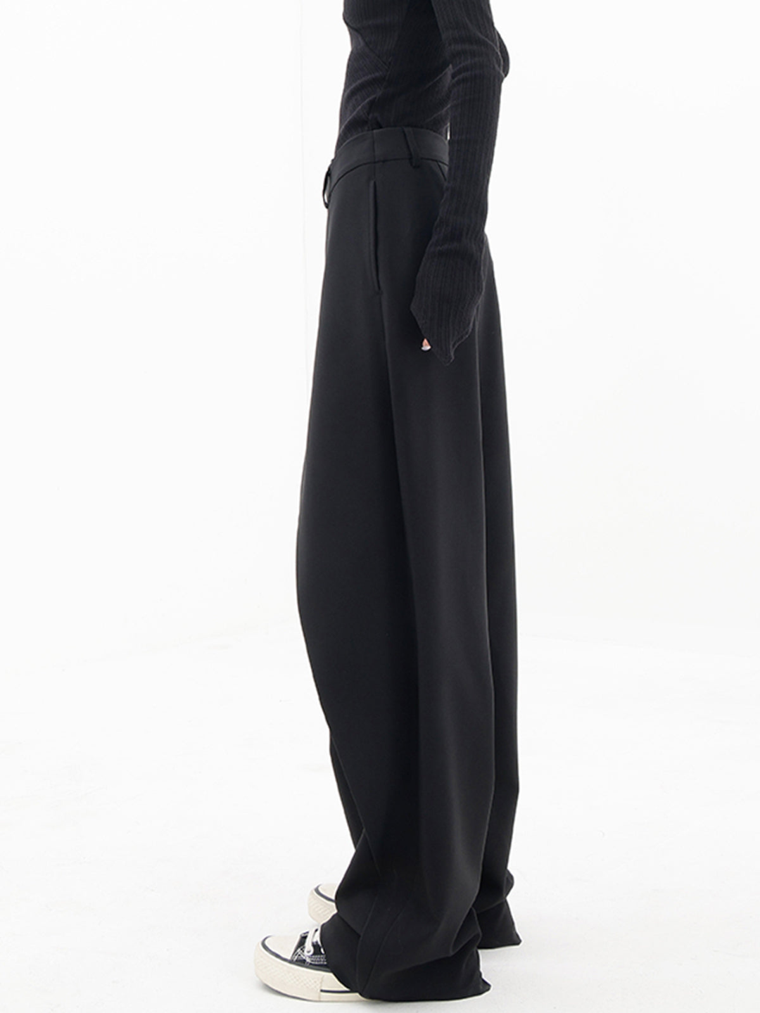 Modern women's asymmetric baggy trousers with a relaxed wide leg fit, perfect for casual chic fashion.