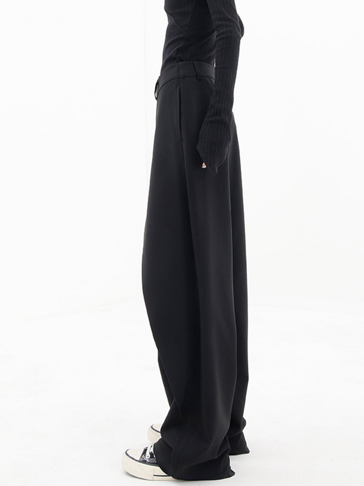 Modern women's asymmetric baggy trousers with a relaxed wide leg fit, perfect for casual chic fashion.