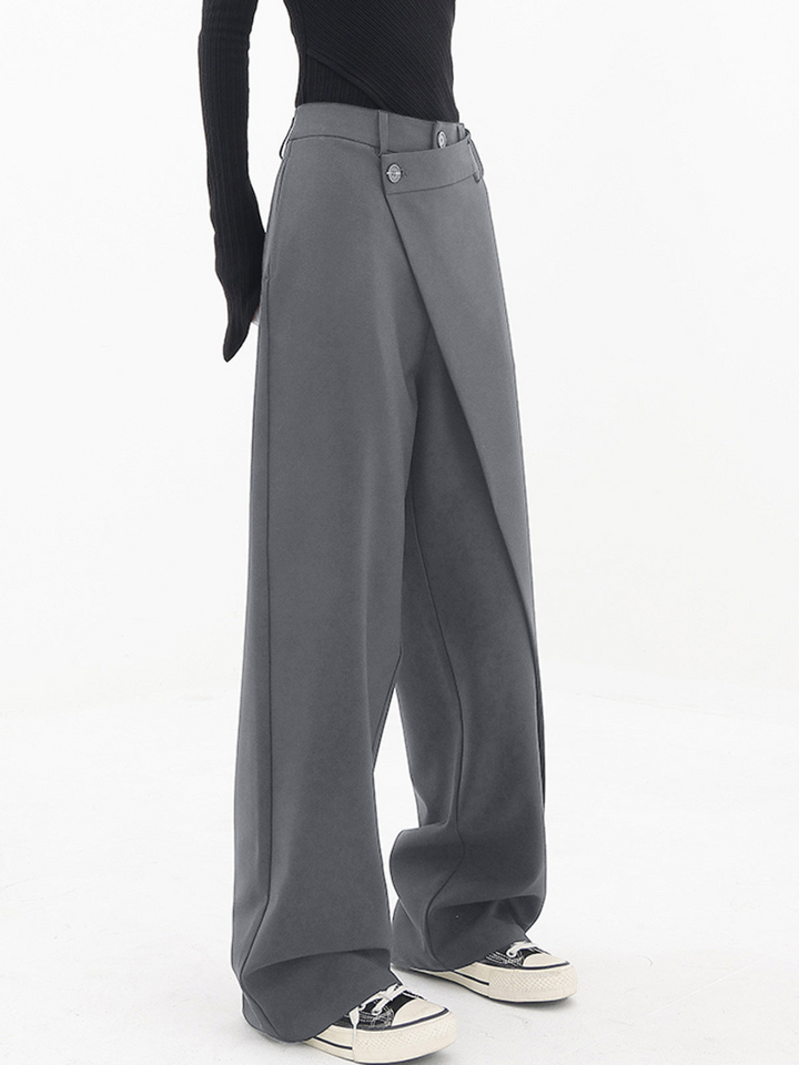 Full length shot of women's comfortable wide leg baggy trousers with asymmetric detailing for versatile style.