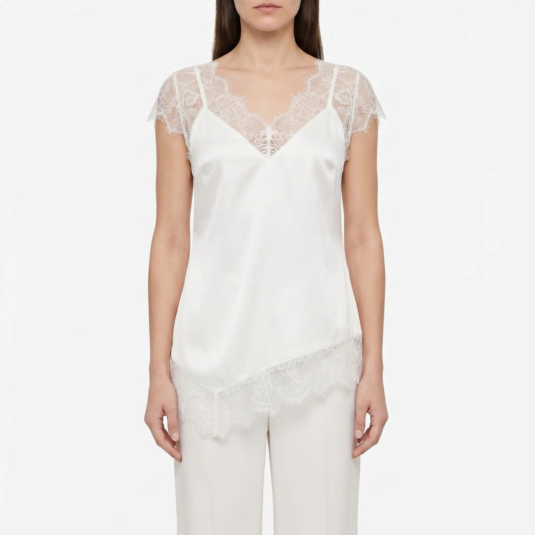 Elegant black asymmetrical top for women, featuring sheer details and a relaxed fit. Versatile summer blouse.