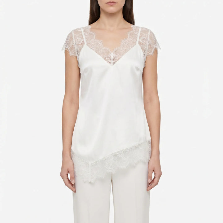Elegant black asymmetrical top for women, featuring sheer details and a relaxed fit. Versatile summer blouse.