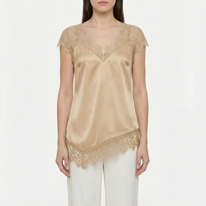 Women's asymmetrical top with elegant sheer details and a comfortable relaxed fit. Sleeveless summer blouse.